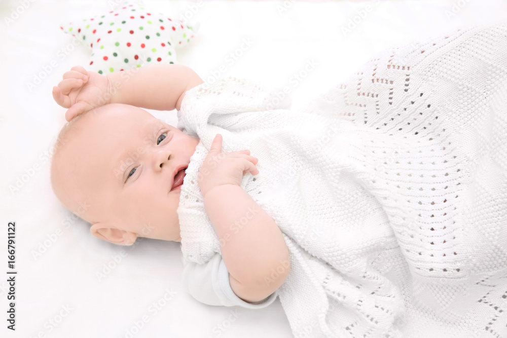 Emotional baby lying in cradle. Insomnia and sleep disorders concept