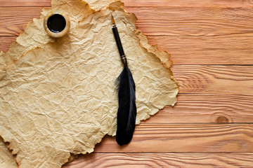 Wall Mural - pen, old paper and inkwell on a coirish wooden table