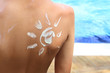 © Hayati Kayhan - Sunscreen lotion over tan skin, sun protection and vacation concept image.