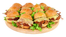 Group Of Small Shredded Beef Sandwich Sliders With Melted Cheese Isolated On A White Background