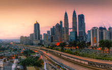 Landscape Of Kuala Lumpur Skyscraper With Colorful Sunrise Sky, Malaysia.