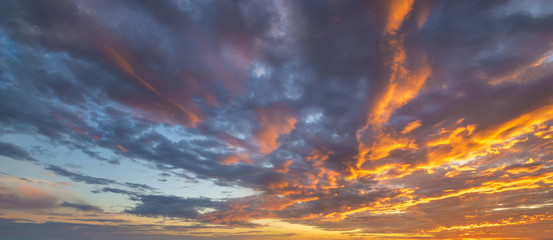 Wall Mural - fiery sunset, colorful clouds in the sky