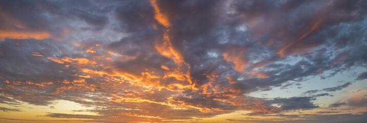 Wall Mural - Fiery sunset, colorful clouds in the sky