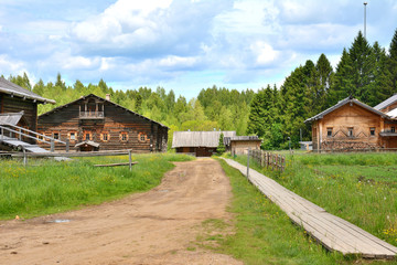 Wall Mural - Village street with a dirt road and wooden sidewalks