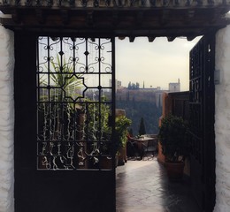 View of Alhambra through a restaurant's entrance