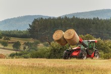Telescopic Collector Straw Collector On Field In The Czech Republic. Work On An Agricultural Farm. Collecting Straw Bales.