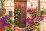 Fototapeta Uliczki - Door surronded by flowers