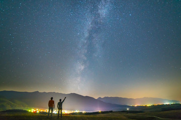 Wall Mural - The two friends stand gesture on the background of the stars. night time
