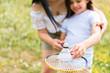 © Yakobchuk Olena - Joyful family playing badminton in the nature