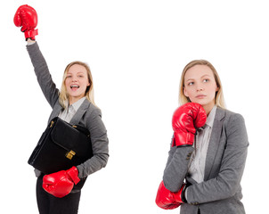 Woman businesswoman with boxing gloves on white