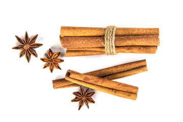 Wall Mural - Close up the brown cinnamon stick with star anise spice isolated on white background , overhead and top view