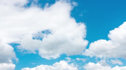 Wall Mural - Beautiful clouds on a blue sky. UHD timelapse