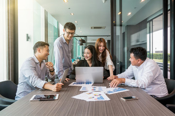 Group Of AsianBusiness people with casual suit working and brainstorming with happy action and celebrate in the modern Office, people business group concept