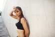 © Liubov Levytska - Perfect female athlete resting after everyday workout. Urban sport concept.