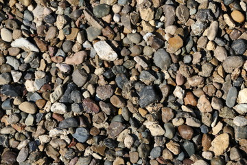 Texture of natural stone - multi-colored pebbles - different-sized stones