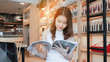 © Kiattisak - Asian young girl reading book magazine fashion smile in cafe shop with coffee brake on vacation holiday rest and relax