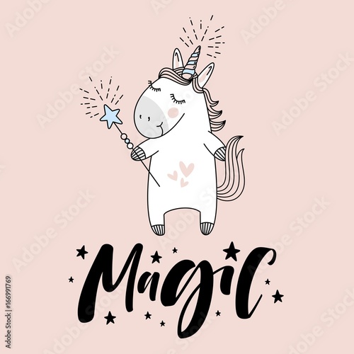 Fotografía cute unicorn with "Magic" hand lettering sign.