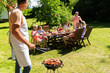 © Syda Productions - man cooking meat on barbecue grill at summer party