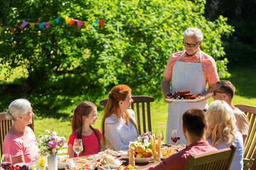 Poster - happy family having dinner or summer garden party