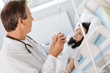© zinkevych - Professional experienced doctor treating his patient