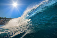 Surfing Wave. Blue Ocean Crest. Sea Water With Sun Over Blue Sky On Backround. Nobody On Image