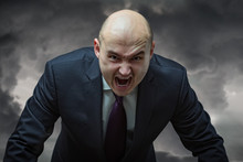 Angry Boss. Businessman In Suit With Very Angry Face Screaming.