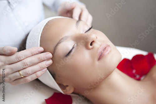 Fotografie, Obraz Spa salon: Young Beautiful Woman Having Facial Massage