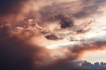 Wall Mural - Colorful and saturated background of the setting sun sky with vivid clouds close up