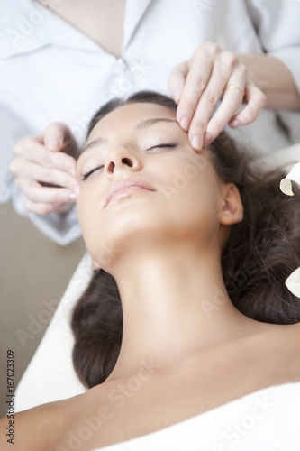 Fotografie, Obraz Spa salon: Young Beautiful Woman Having Facial Massage