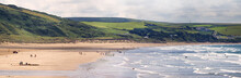 Panoramic View Of The Beach Of Woolacombe. Waves On The Sea And People On The Shore.