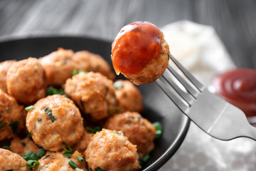 Canvas Print - Fork and plate with delicious turkey meatballs on table, closeup