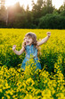 © Денис Кипкаев - A young girl walks the yellow field