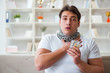© Elnur - Young man suffering from sore throat