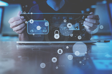 Poster - cyber security internet and networking concept.Businessman hand working with VR screen padlock icon on computer background