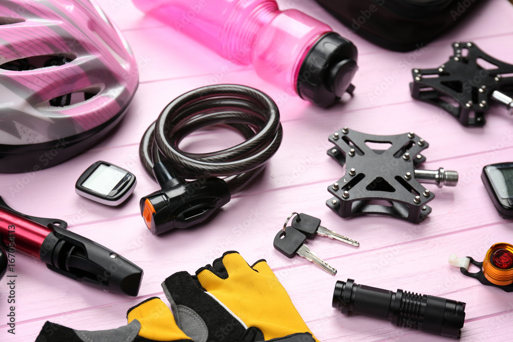 Set of accessories for cycling on wooden background