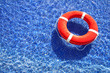 Orange lifeguard in pool