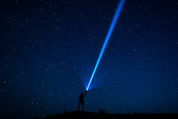 stars in the sky. the traveler looks at the starry sky. night sky with stars and silhouette of a man