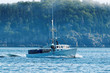 A lobster boat heads out to set his traps