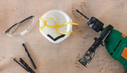 tools drill and glasses in workshop