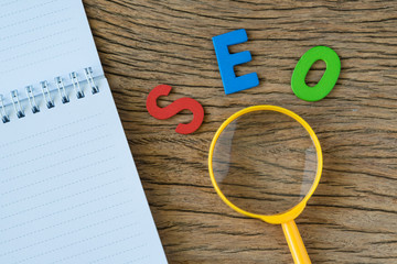 Aufkleber - seo search engine optimisation concept as colorful alphabet abbreviation seo with magnifying glass a