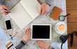 © Prostock-studio - Couple planning vacation, search and notes