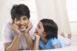 © IndiaPix - Portrait of father and son smiling