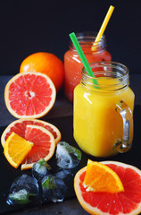 Sticker - Grapefruit and orange juice in two glass