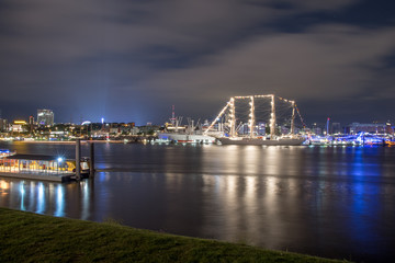 Hamburg, Germany, Panorama of the Harbour at night. With the colored illuminated music hall at Christopher Street Day