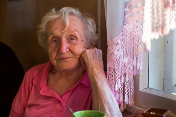 Portrait of an elderly Russian woman in her home.