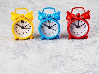 Retro alarm clocks on a table. Photo in retro color image style