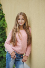 Wall Mural - beautiful young girl posing on the street