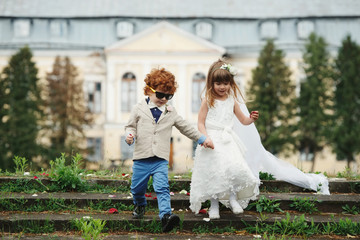 Canvas Print - two funny little bride and groom