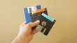 © christian - Office man clerk with floppy disks on his hand