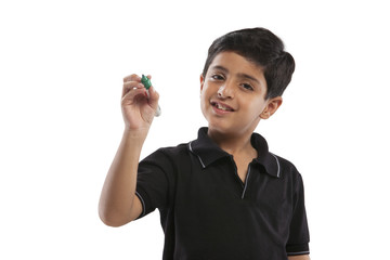 Wall Mural - Young boy holding a marker pen 